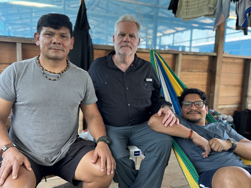 ELIN faculty affiliate Scott Wallace, center, with Indigenous leaders Beto Marubo, left, and Eliesio Marubo, right, in the Javari Valley Indigenous Territory, Amazon Rainforest, Brazil, July 2025.